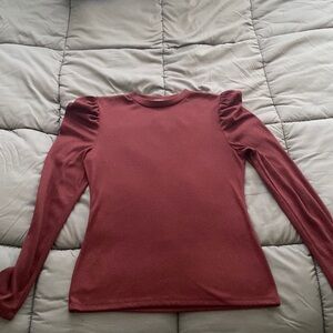 Long sleeve burgundy mock turtleneck with puffy sleeves at the shoulders
